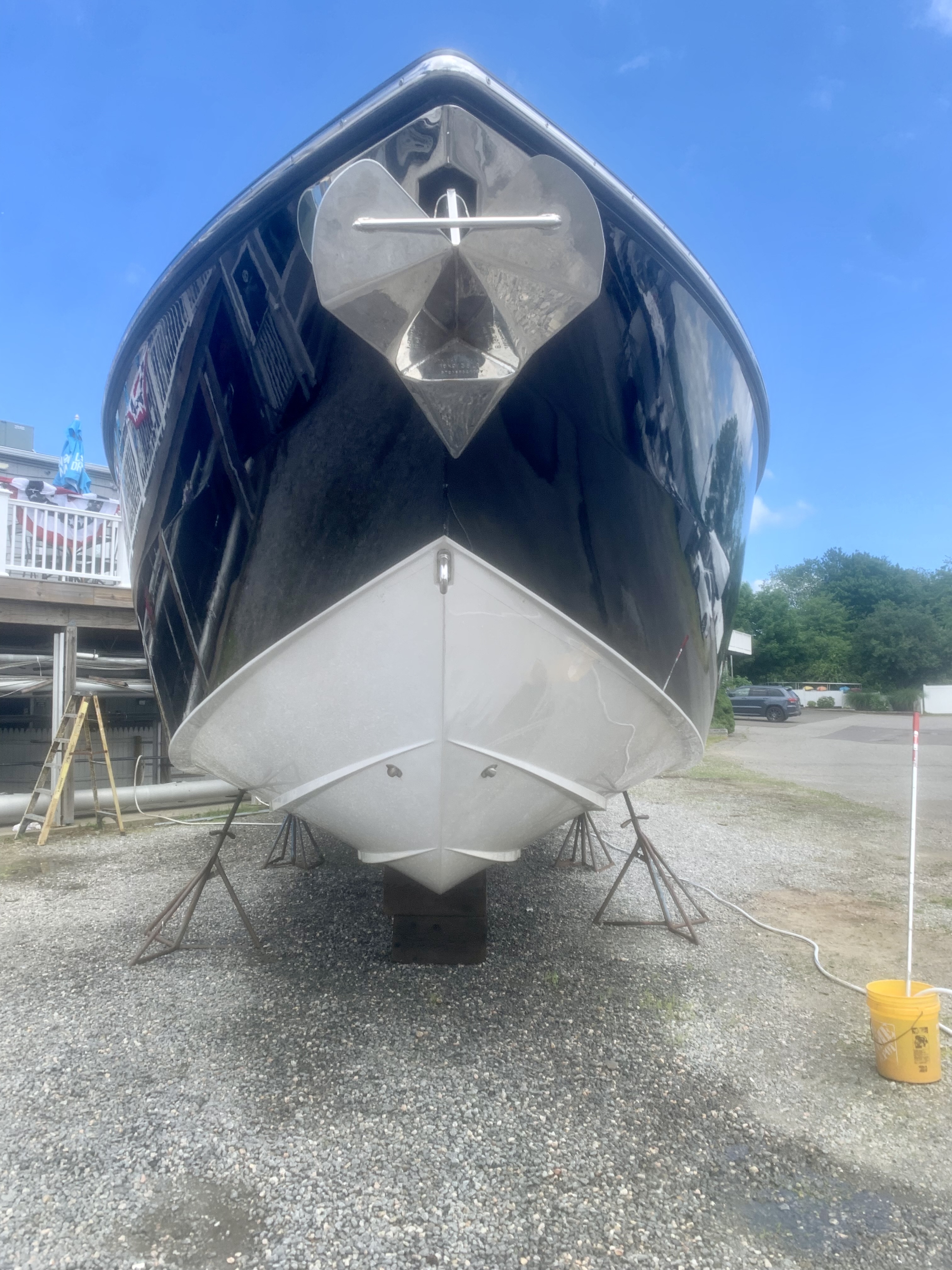 Bottom paint detail on black yacht hull